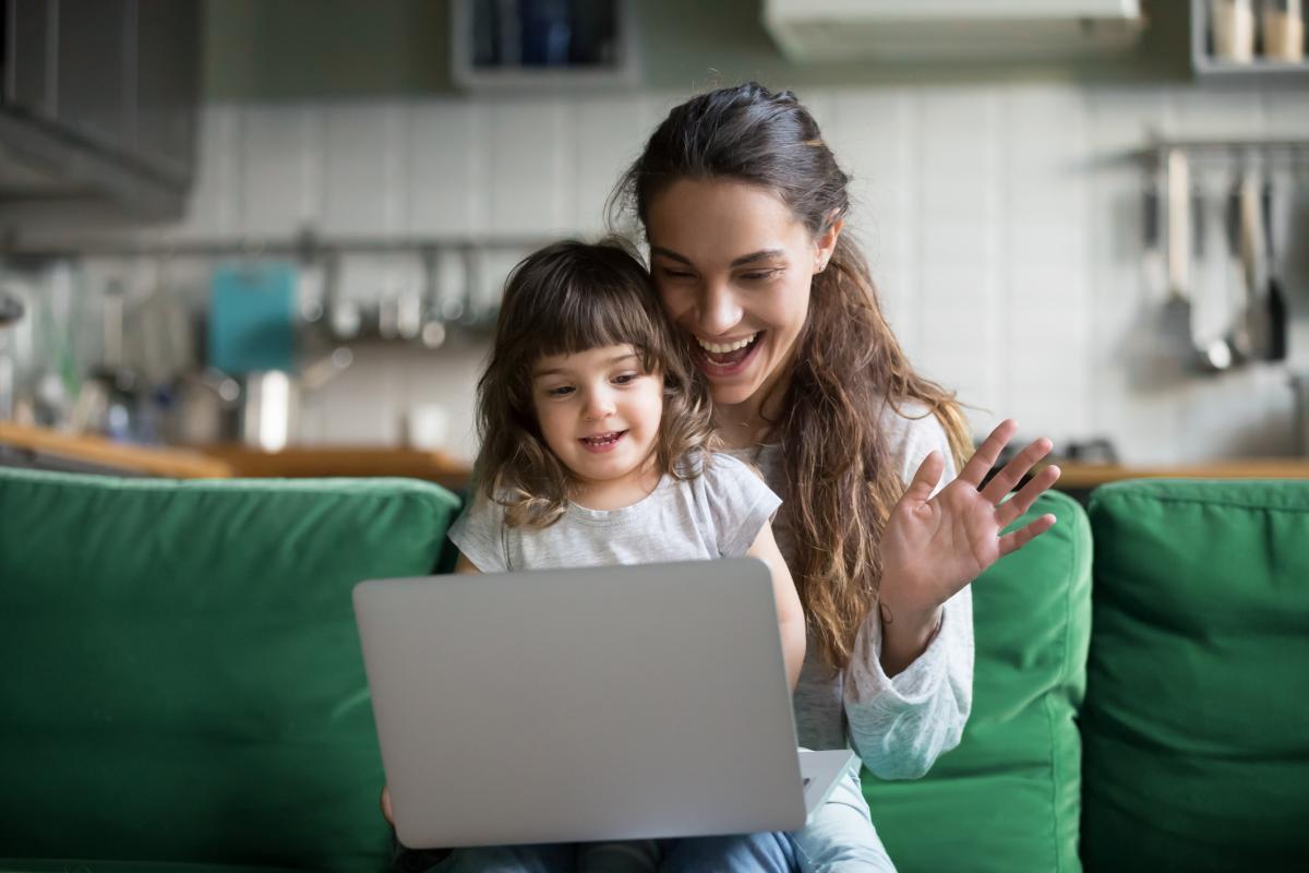 Mom and young daugter on tablet using video chat