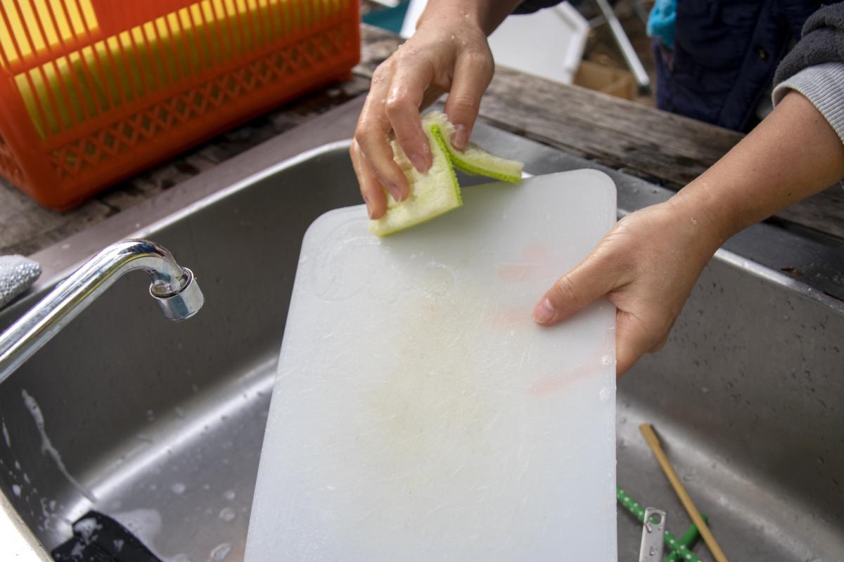 Washing a cutting board after outdoor use