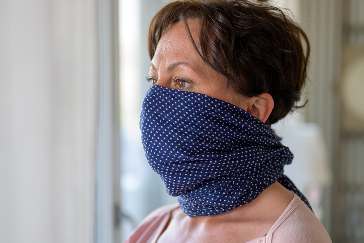 woman wearing a cloth scarf as a face covering
