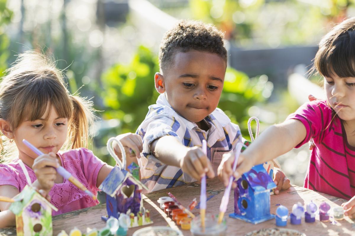 Preschoolers doing crafts outside