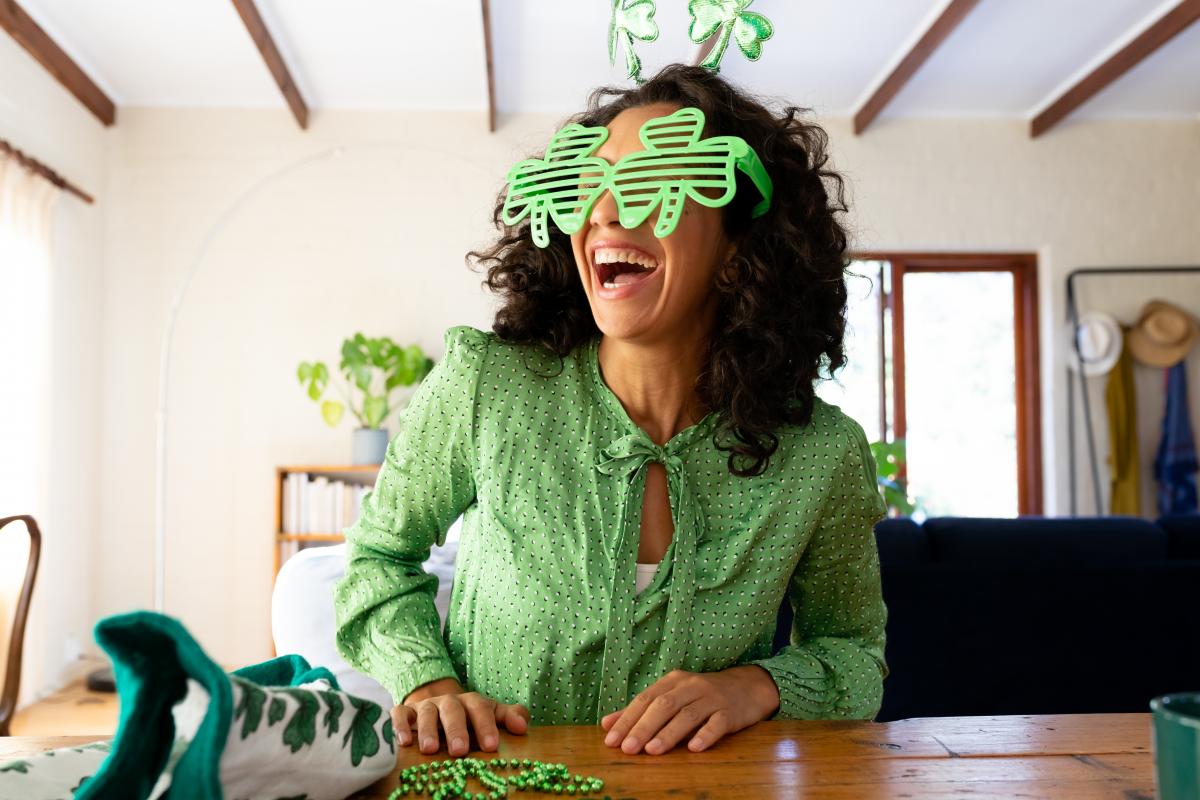 A woman is dressed for St. Patrick's Day.