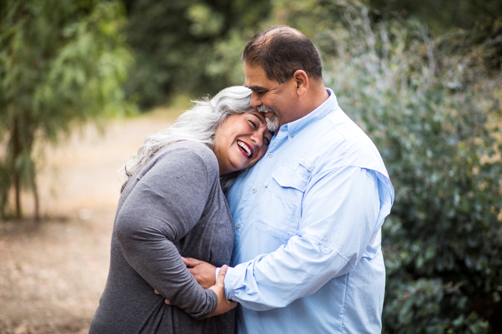 Mature couple hugging in the woods