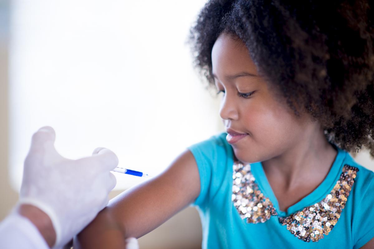 Young girl getting a flu shot