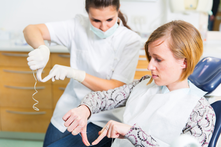 Woman learning to floss