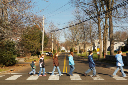 Pedestrians crossing at a crosswalk