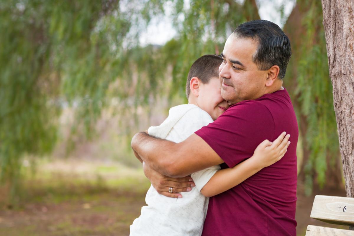 dad and son hugging