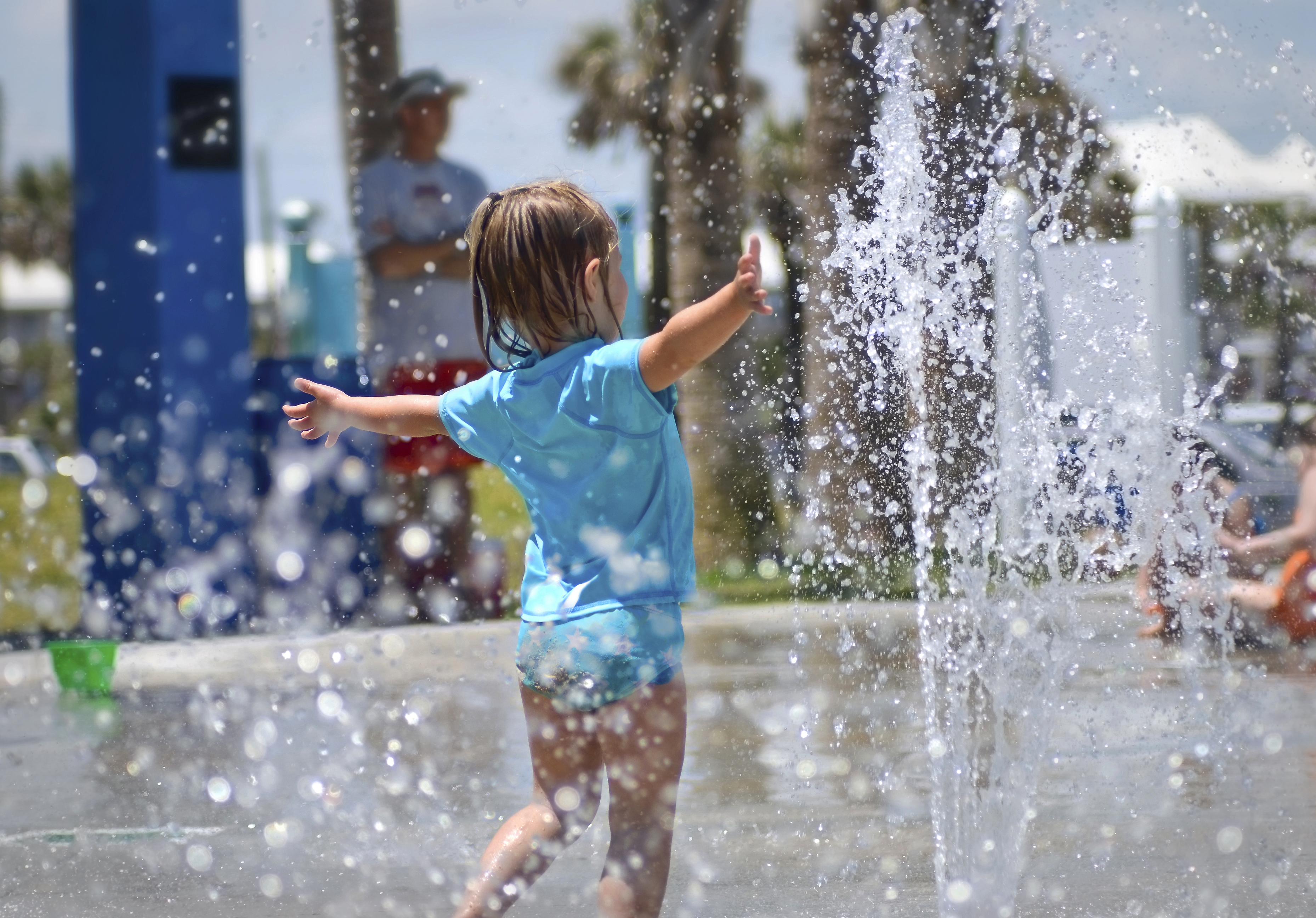 Girl running at splash pad