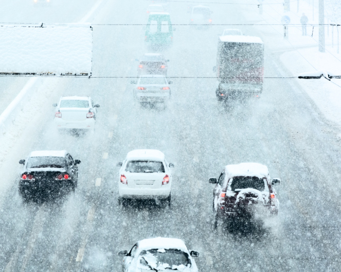 Cars on snowy highway