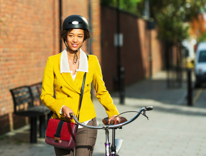 Woman riding bike home from work