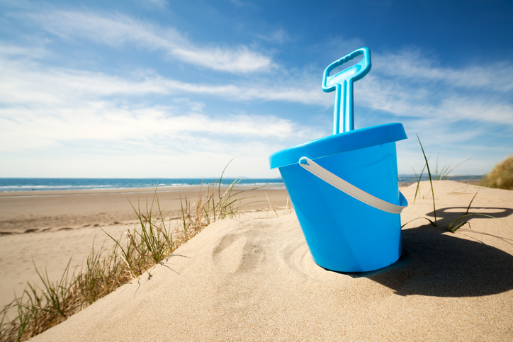 Pail and shovel in sand