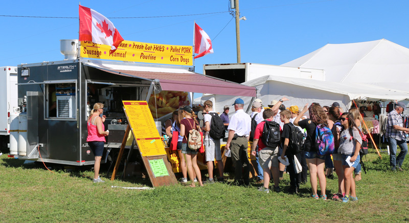 Food vendor and people in line at IPM
