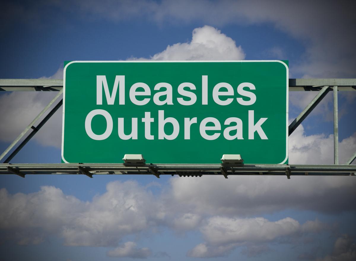 Sign that says "Measles outbreak"