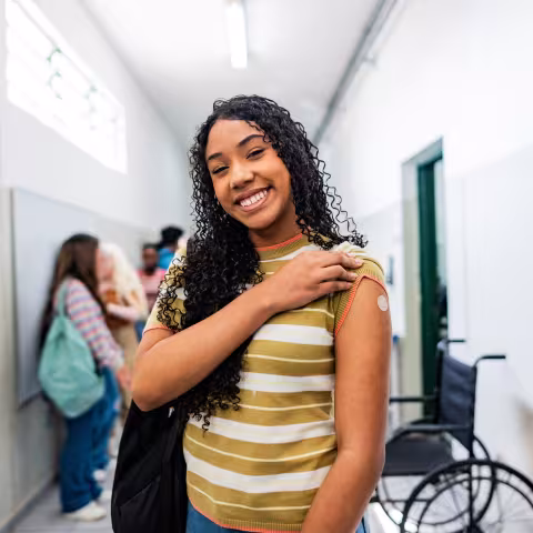Portrait of a teenager student after taking vaccine at school