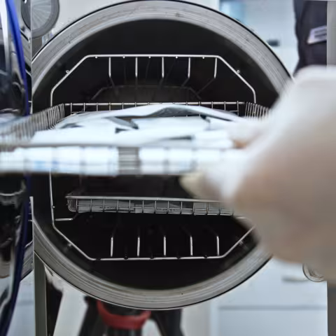Laboratory Technician Sterilizing Medical Instruments
