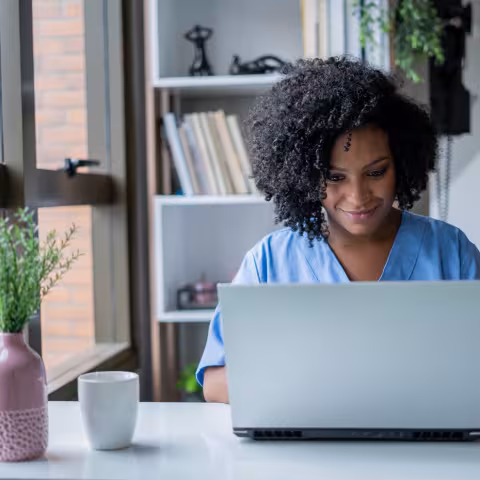 Nurse on computer in office