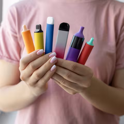 Vape cigarettes in woman hand