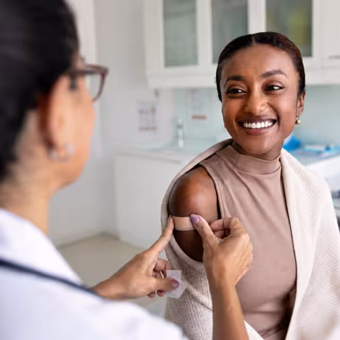 Young black female getting a vaccine