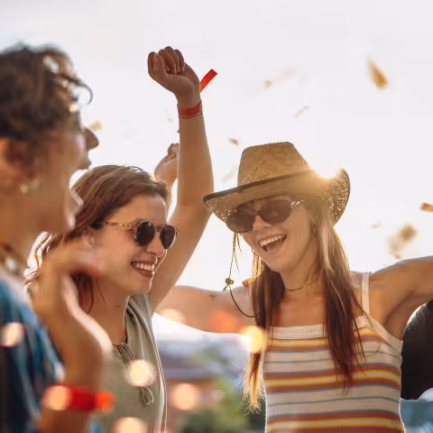 A young group of friends enjoying an outdoor gathering.