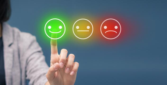 Three options showing a happy face, straight face, and unhappy face