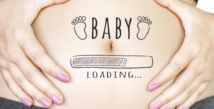 a pregnant person holding their tummy. On the tummy the words "Baby loading..." is written with a computer loading image