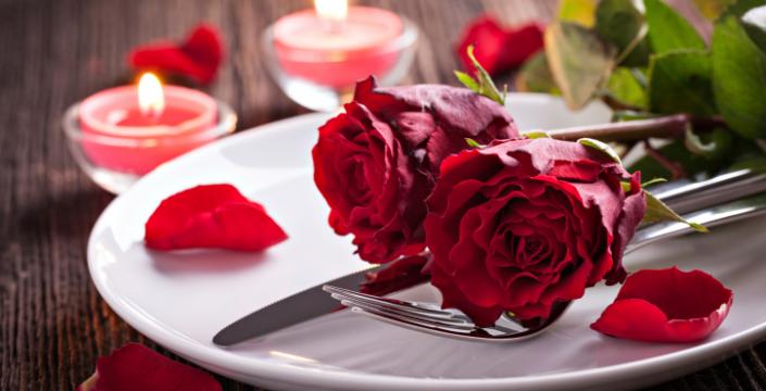 Red Roses resting on a white plate