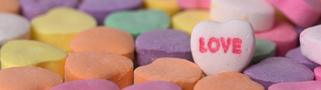 Pastel-coloured conversation hearts candy