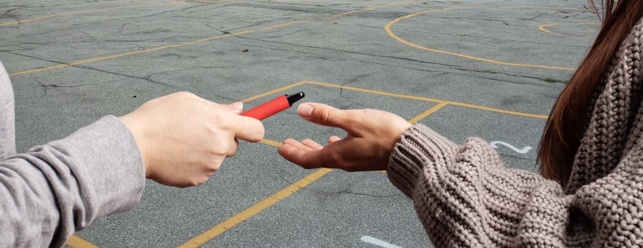 Teens sharing vapes at school