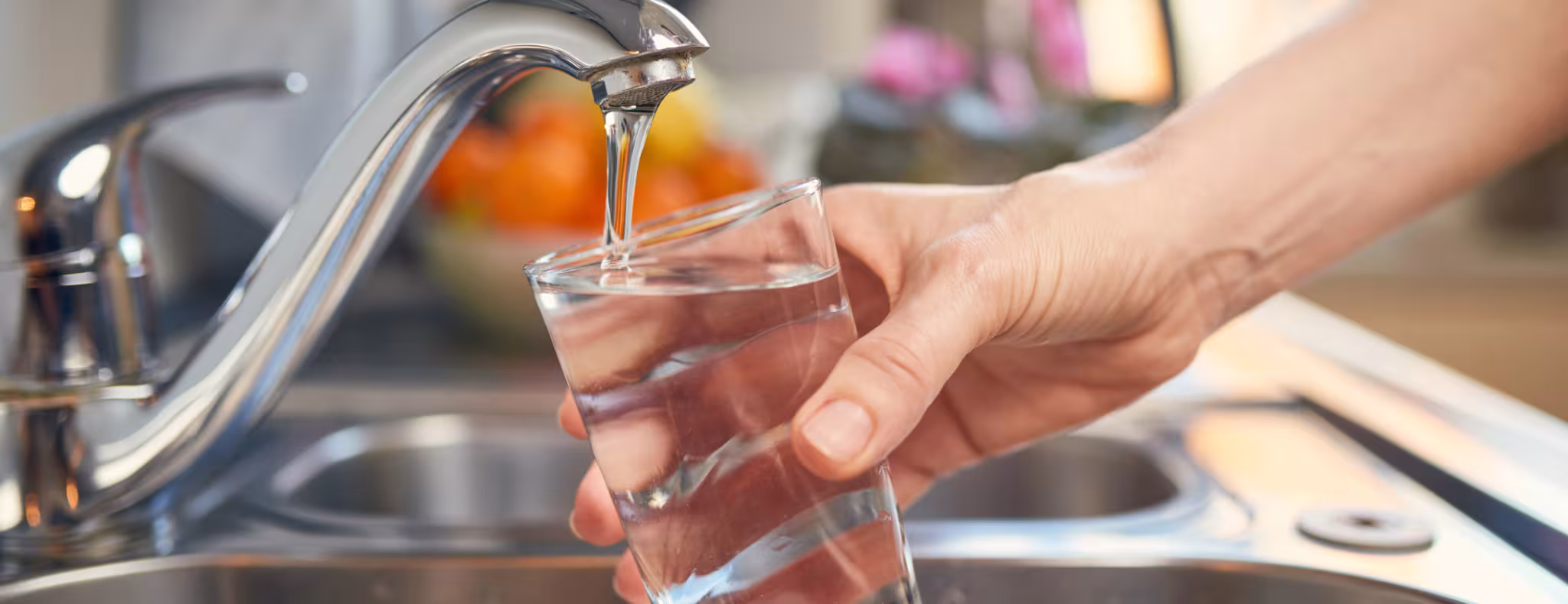 Pouring Fresh Tap Water Into a Glass