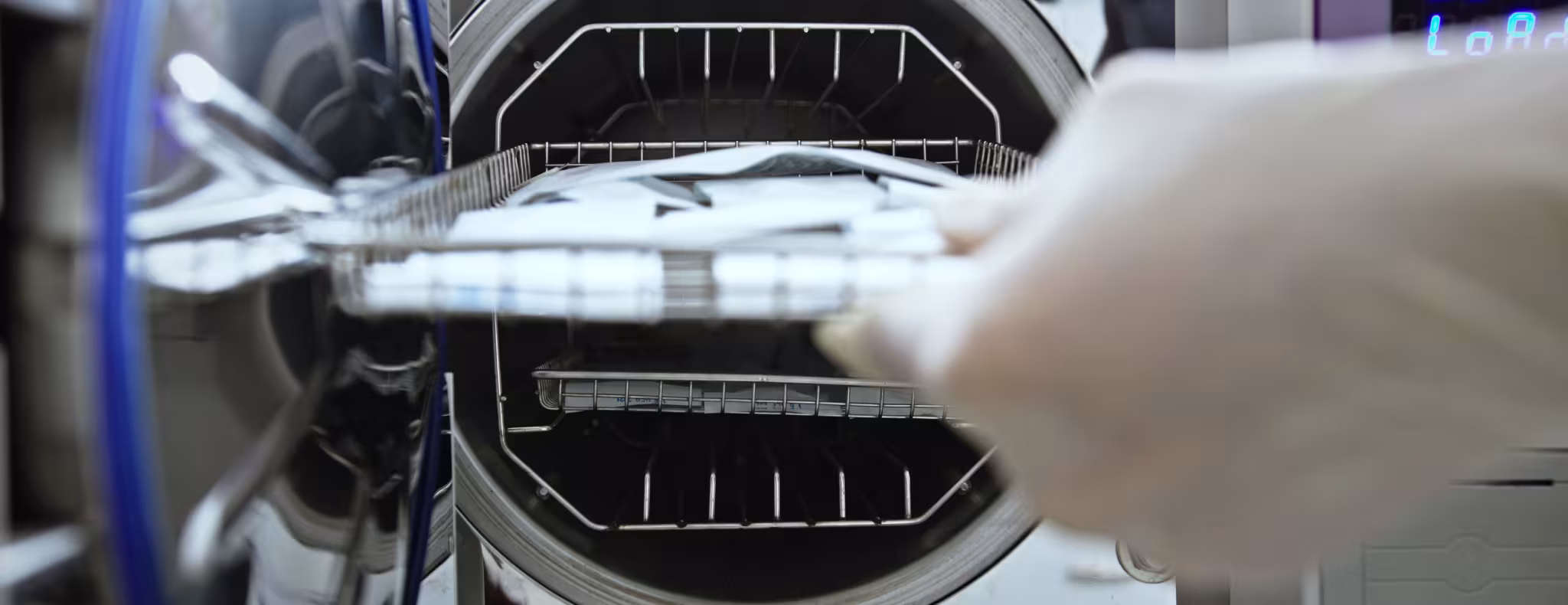 Laboratory Technician Sterilizing Medical Instruments