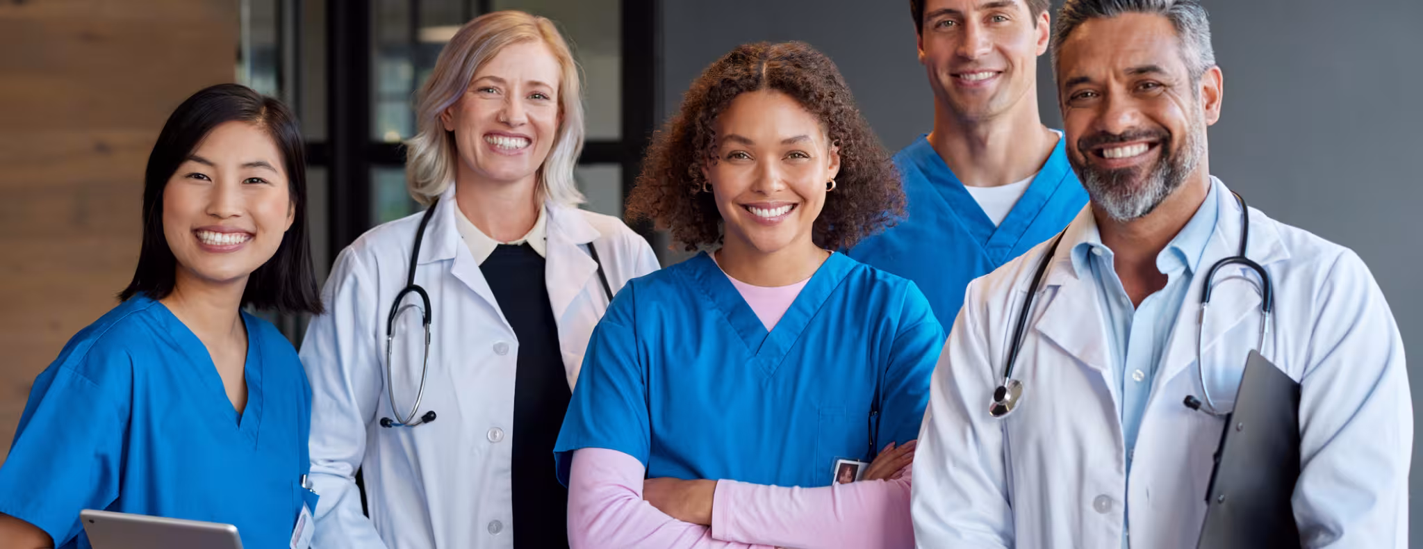 Portrait of happy smiling healthcare team looking at camera