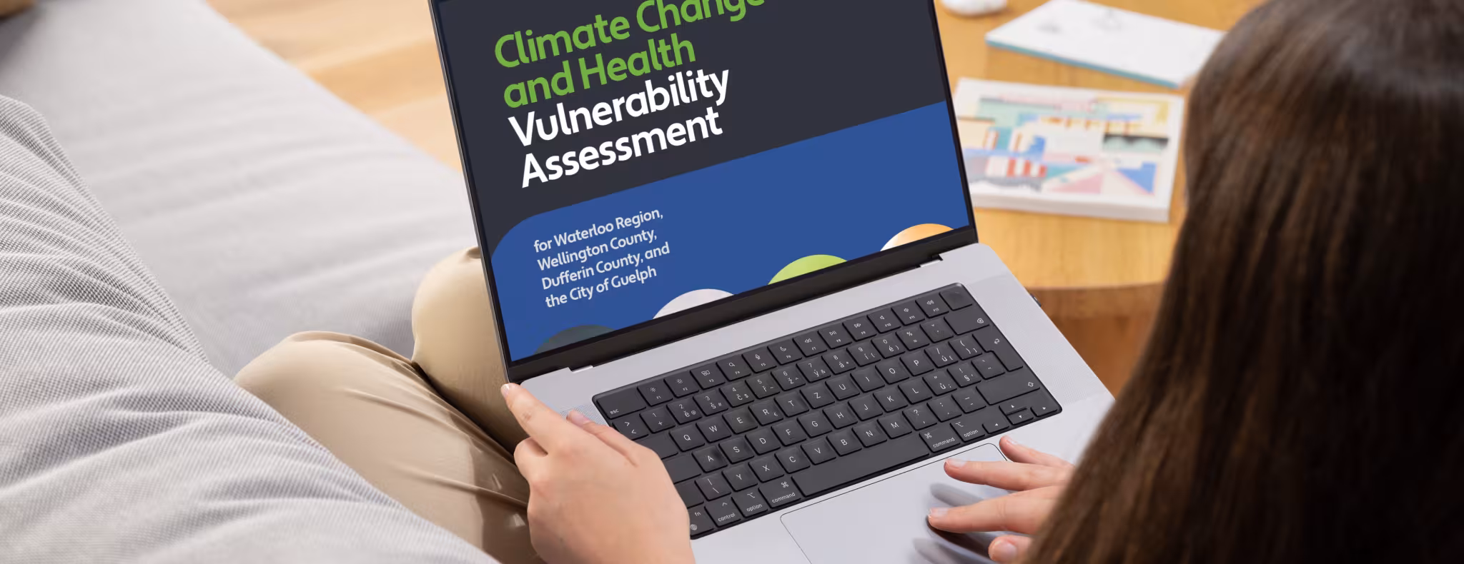 Woman viewing climate change report on laptop