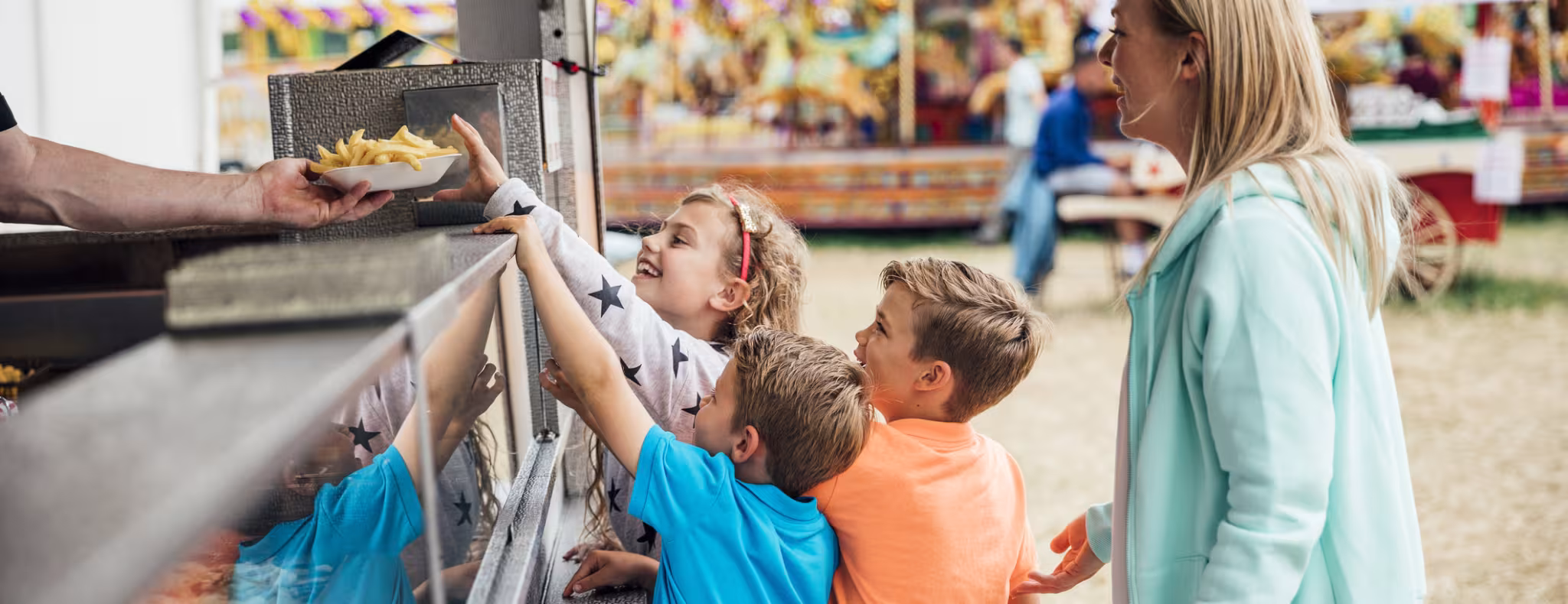 Family getting Food at the Fairground