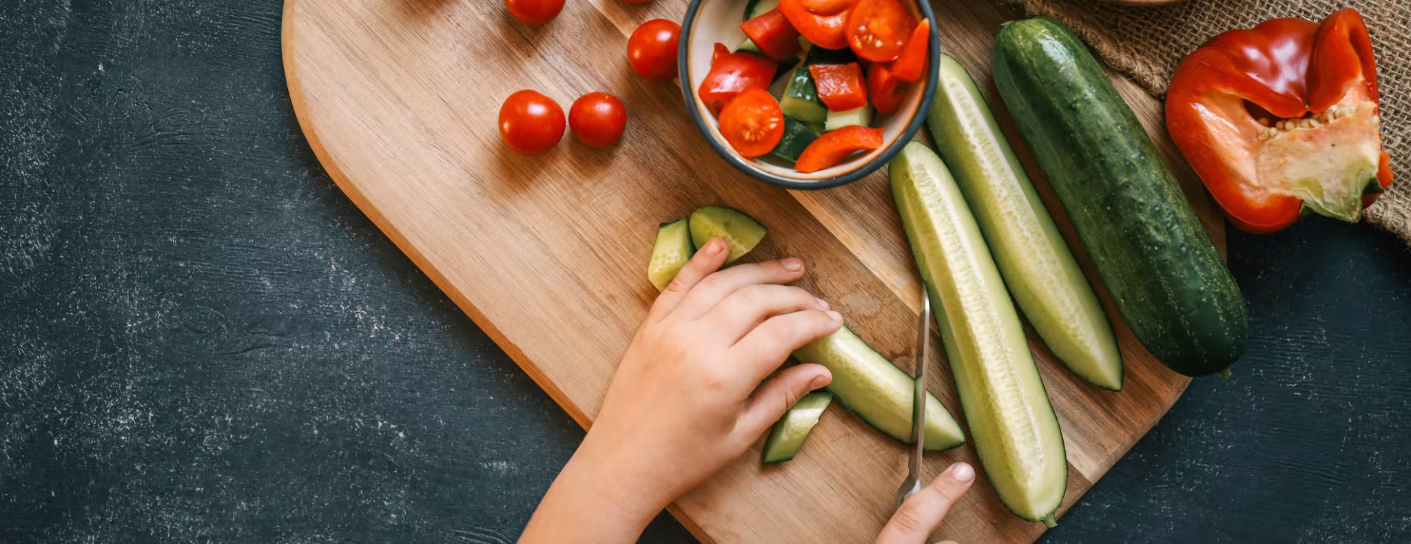 Girl cutting salad, organic healthy food