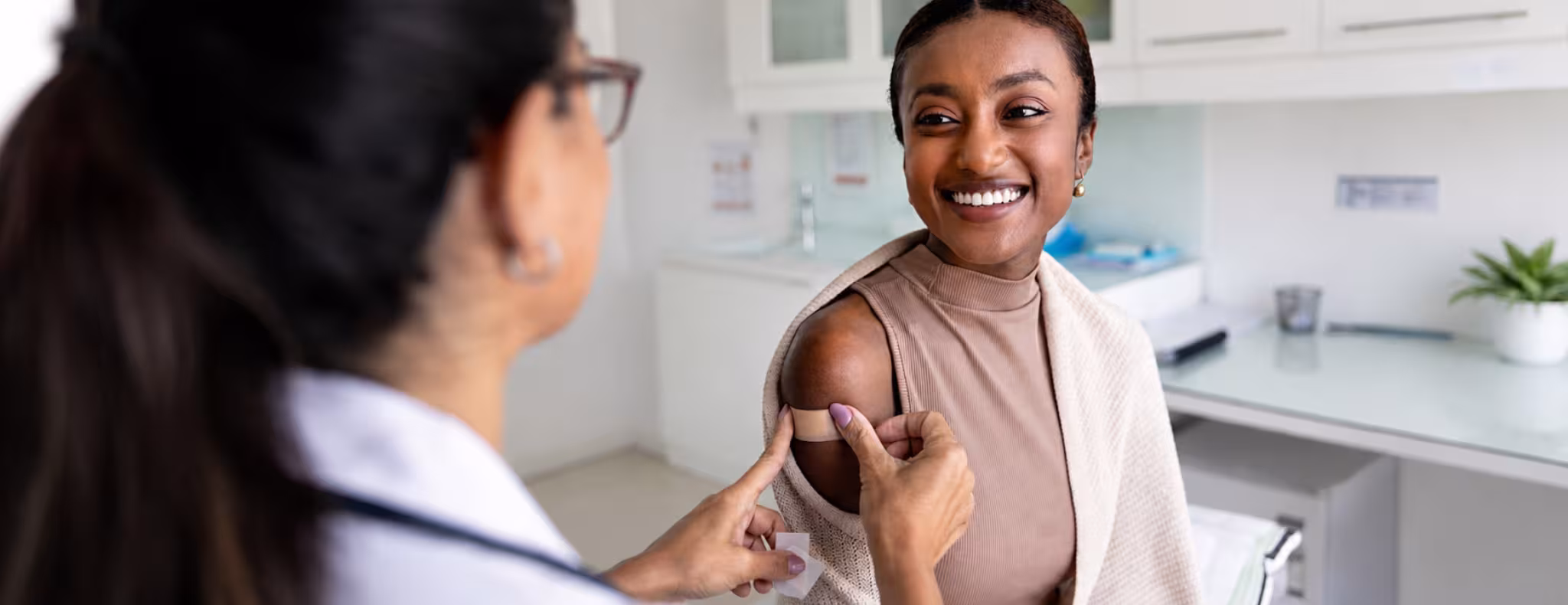 Young black female getting a vaccine