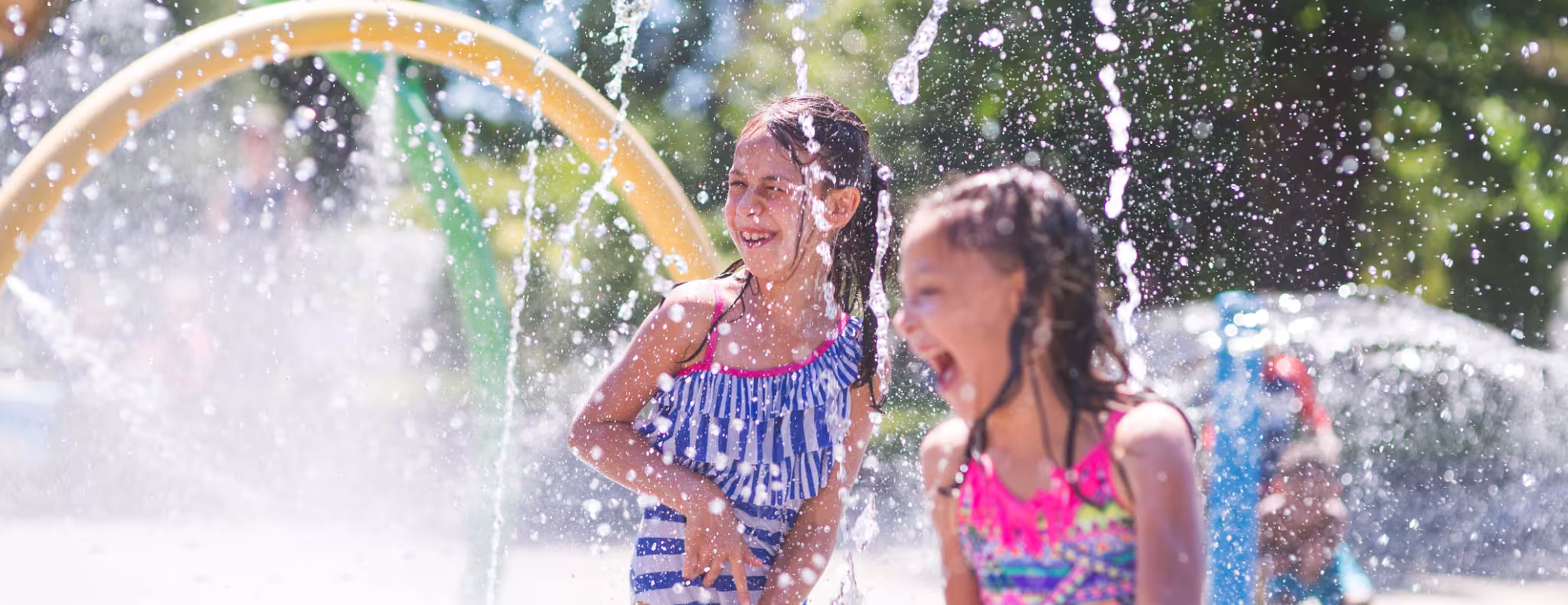 Kids enjoying summer afternoon at the splash pad