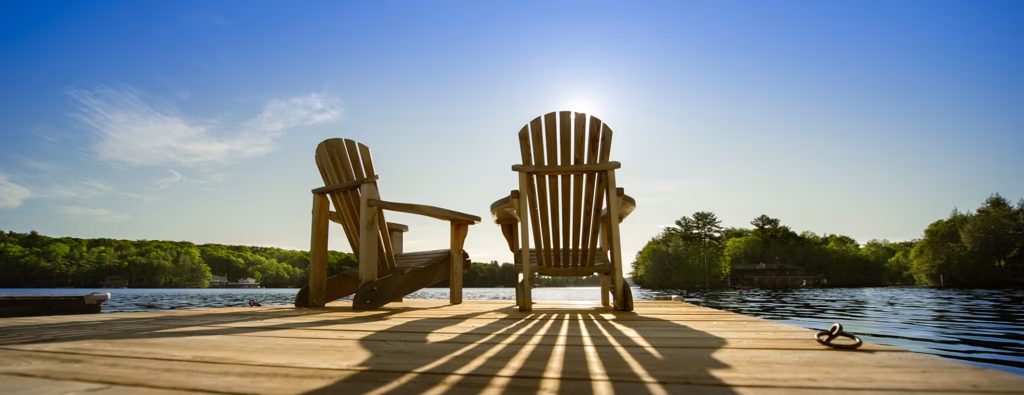 muskoka chairs on a dock long weekend